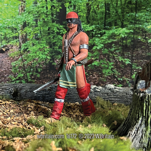 Collectible toy soldier miniature army men Native Warrior Walking. He is in the woods.