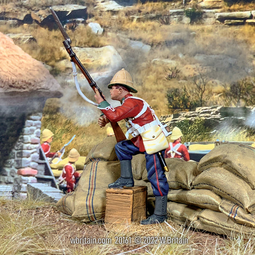 Collectible toy soldier miniature British 34th Foot with Foot on Biscuit Box. He is on the battlefield.