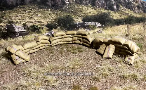 Toy soldier diorama sand bags in a field.