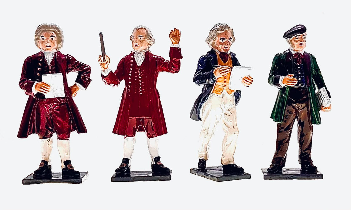 Tradition of London T108 figures of Bach, Mozart, Beethoven and Wagner, four 54mm gloss composers holding scores, a baton and a pen.