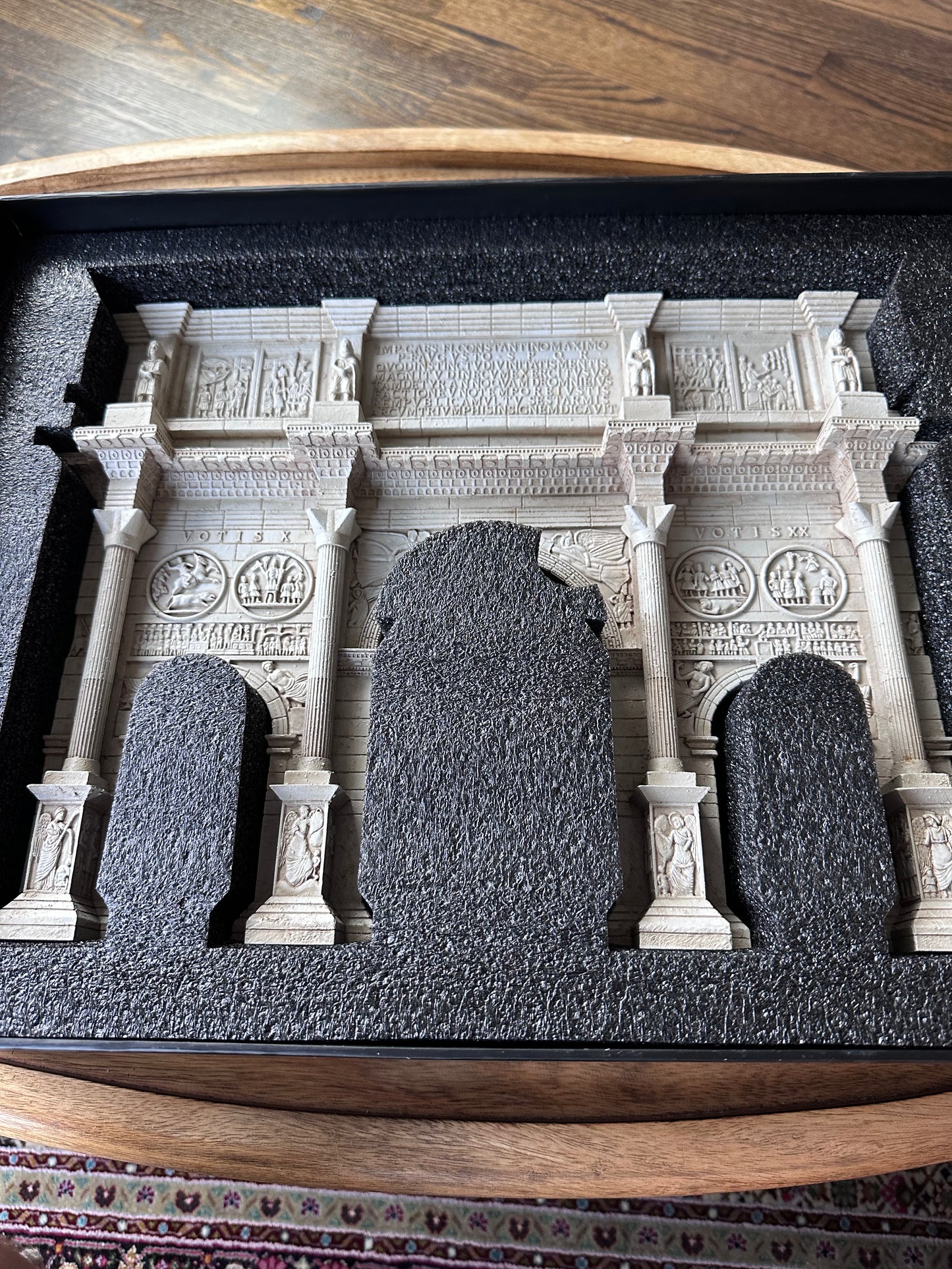 Model of a classical arch with columns on a wooden base