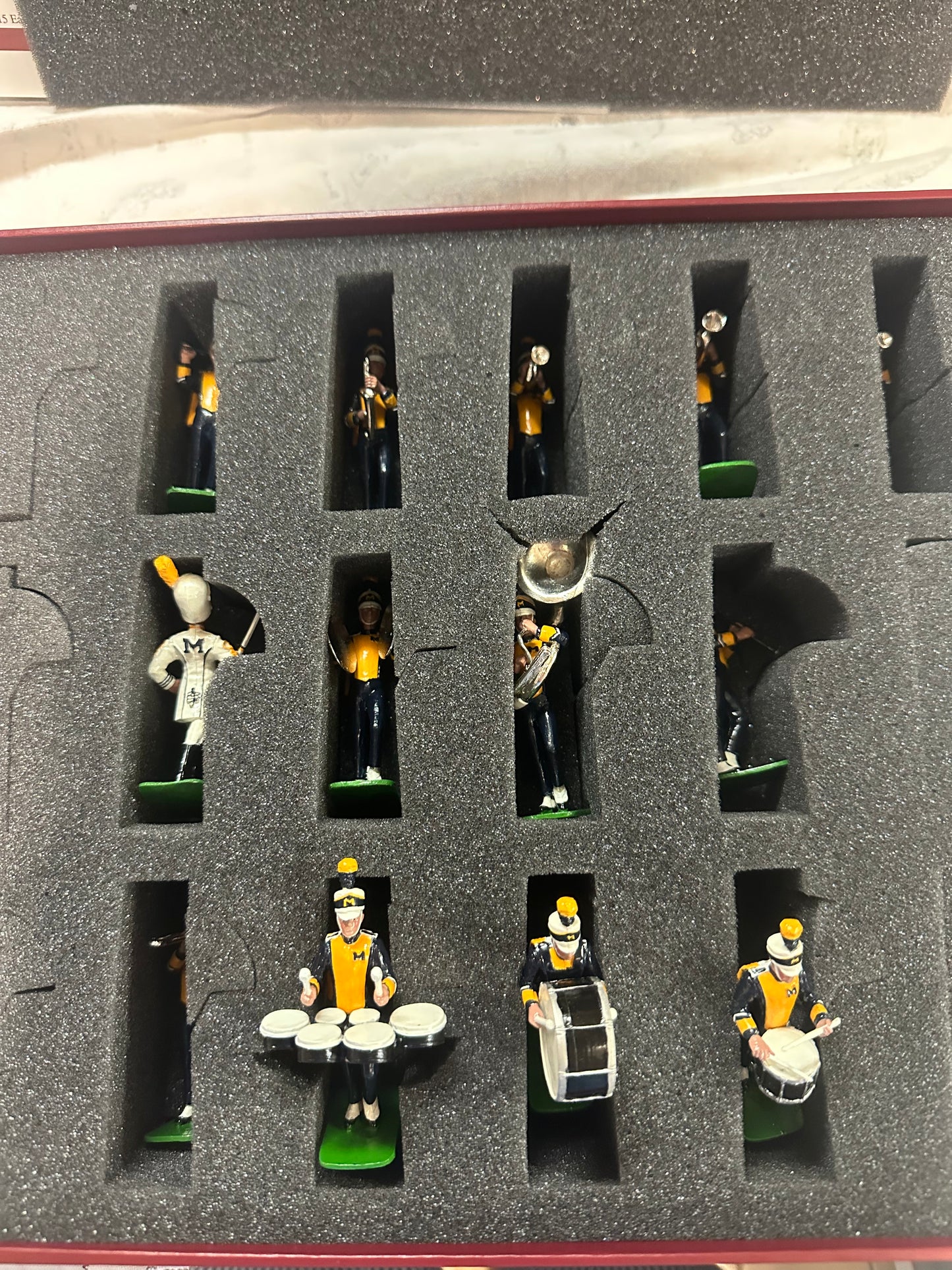 Packaging of toy miniature marching band University of Michigan.