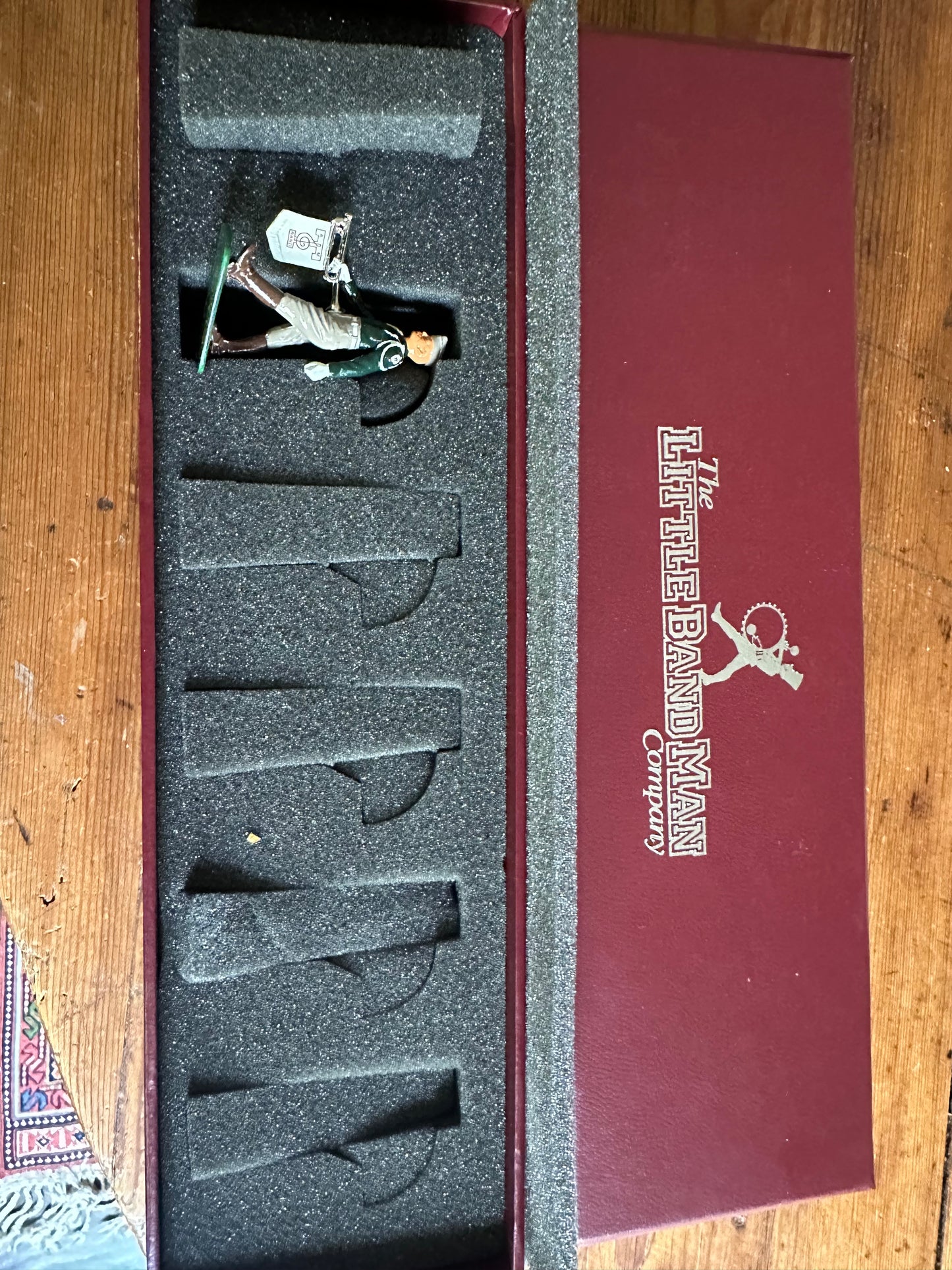 Packaging of toy soldier set Texas A&M in maroon box.