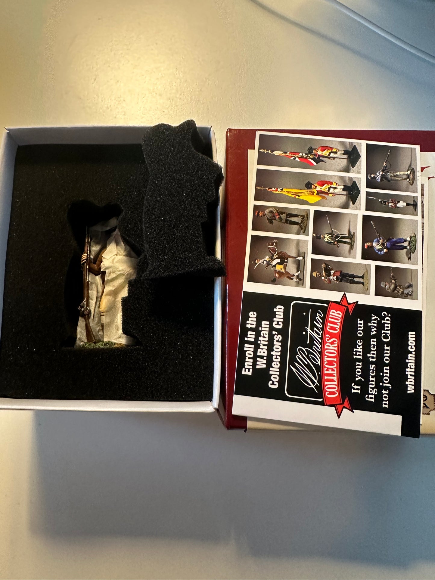 Packaging for Collectible toy soldier miniature American Militiaman in brown clothing holding a musket.