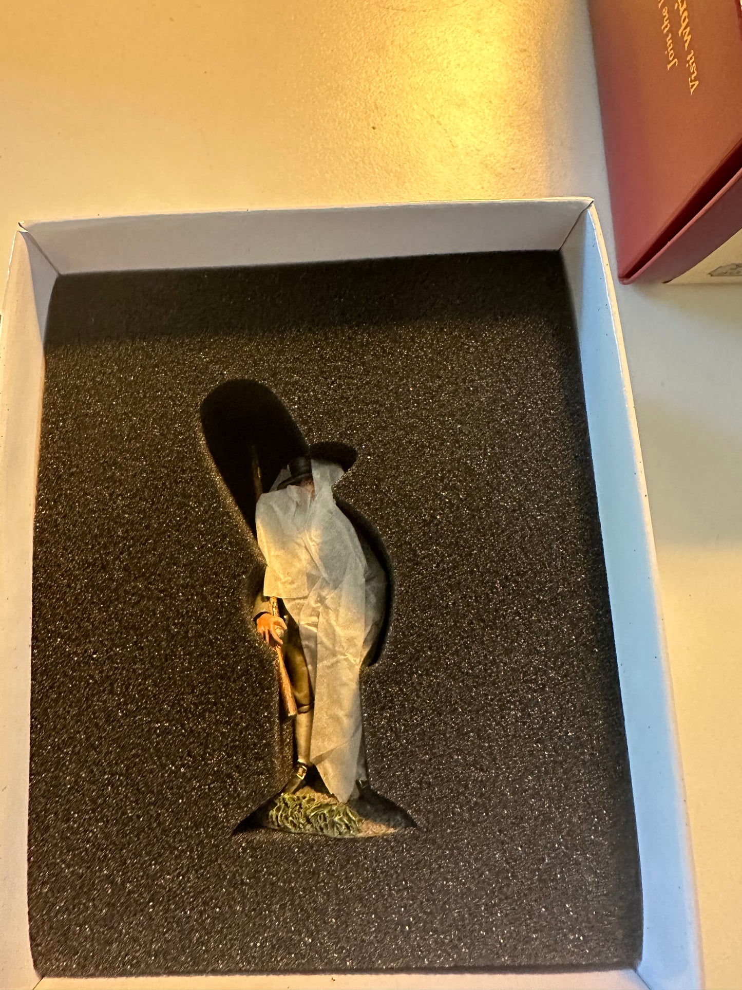 Packaging for Collectible toy soldier American Militiaman in olive uniform holding a musket.