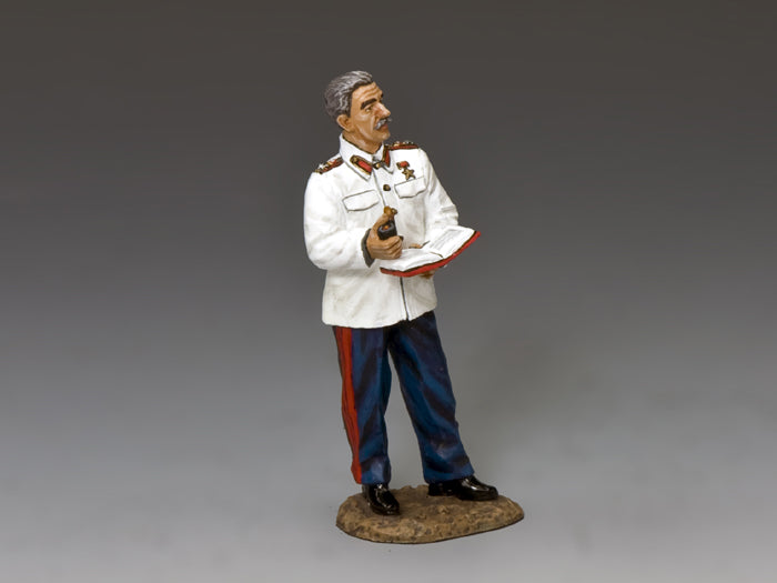 Figurine of a man in a white uniform with red and blue accents on a gray background