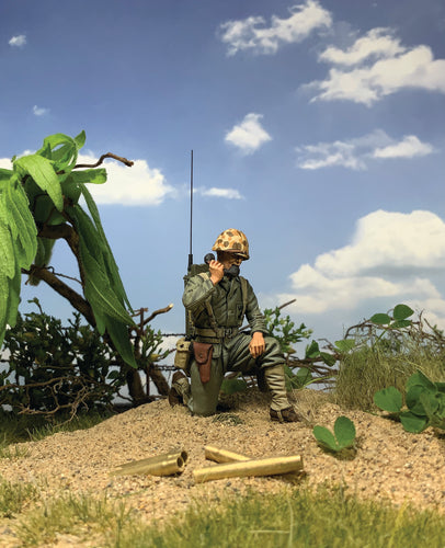 Toy soldier army men U.S. Marine with SCR300 Radio 1944-45. He is on the beach.