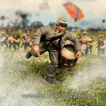 Toy soldier miniature army men Young Confederate Drummer Advancing. On the battlefield.