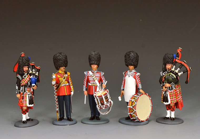 King & Country Scots Guards Pipes & Drums band in ceremonial dress — pipers and the three new drummers (CE120 Drummer, CE122 Drum Major, CE123 Bass Drummer) released May 2026