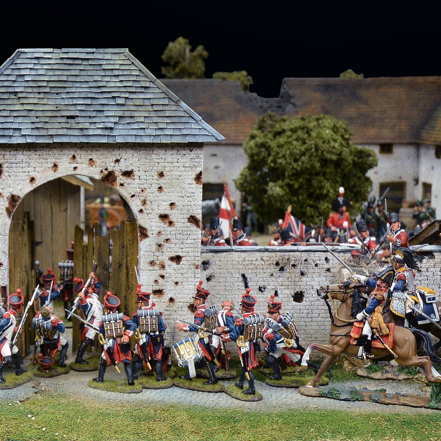 Breagans K&C Diorama Accessories — European Farm Gateway in a Napoleonic battle scene with French infantry attacking and Allied defenders on the walls.