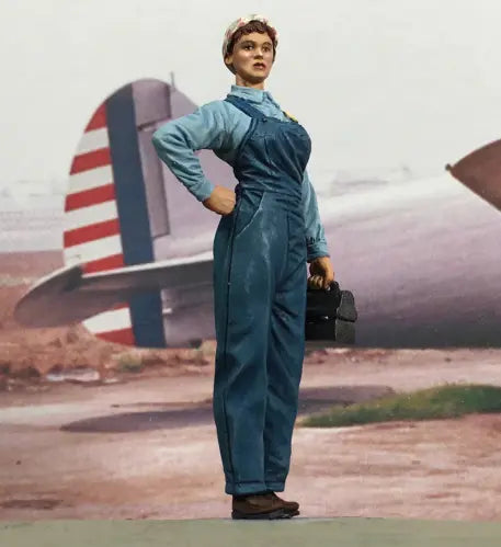 Collectible civilian miniature figurine Rosie the Riveter near a plane.