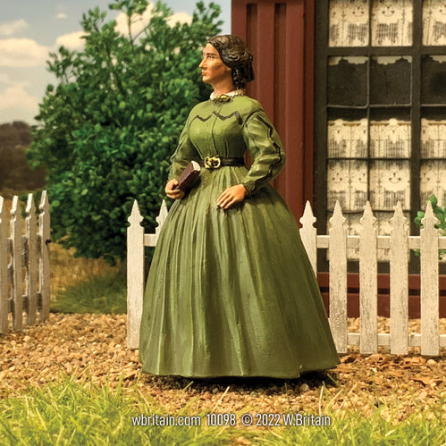 Civilian miniature figurine Harriet Beecher Stowe, American Author and Abolitionist. She is outdoors.