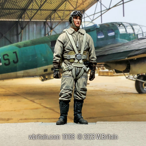 Collectible toy soldier miniature German Luftwaffe Bomber Pilot. He is in the hanger with a plane.