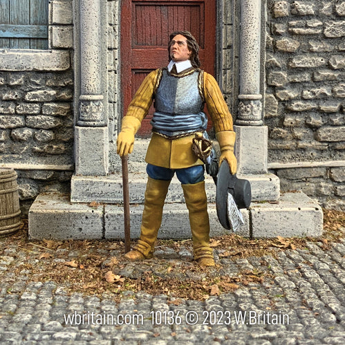 Collectible toy soldier army man Oliver Cromwell. Standing in front of a building.