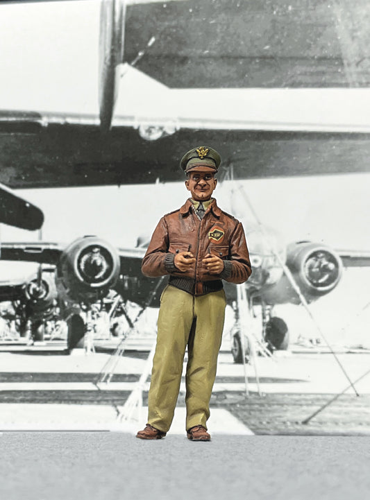 1/30 scale figure of Lt. Col. James Doolittle in 1942 A-2 flight jacket, standing before a WWII bomber backdrop.
