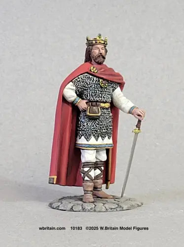 W. Britain Charlemagne toy soldier — crowned medieval king in red cloak and mail armor, holding a long sword grounded before him. 1/30 scale matte-painted figure, catalog 10183.