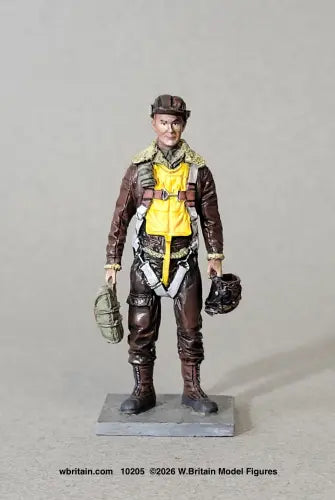 W. Britain 10205 figure of a USAAF heavy bomber crewman in a fleece-collared leather flight jacket, B-2 leather flying cap, yellow Mae West and parachute harness, carrying a flight bag and helmet.