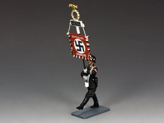 Model figure of a soldier holding a banner with a swastika symbol on a gray background