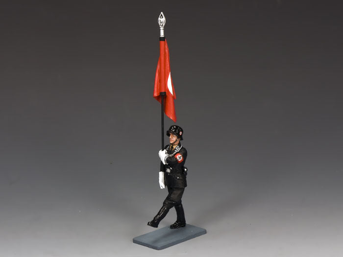 Model figure of a soldier holding a red flag on a gray background