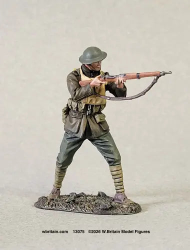 W. Britain U.S. Marine in standing firing pose at Belleau Wood, 1918 — 1/30 scale matte-painted WWI figure with rifle shouldered, in Brodie helmet and green wool service uniform. Catalog 13075.