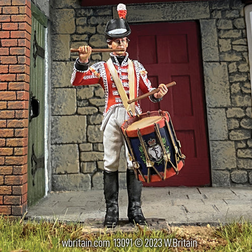 Collectible toy soldier miniature army men British Royal Marine Drummer figurine. Outside in front of a building.