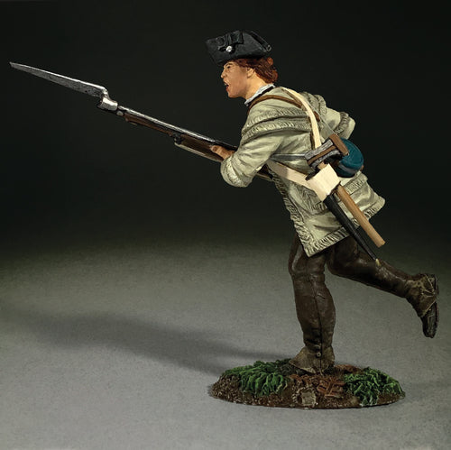 Collectible toy soldier miniature wearing green and brown uniform. Soldier is charging with musket and bayonet.