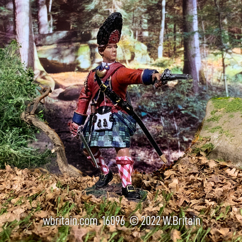 Collectible toy soldier miniature 42nd Foot Royal Highland Regiment. Soldier is holding revolver and sword in the forest.