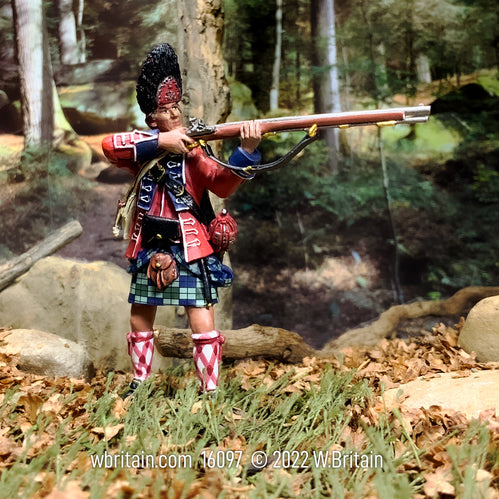 Collectible toy soldier miniature 42nd Foot Royal Highland Regiment. Soldier is in the forest aiming musket.