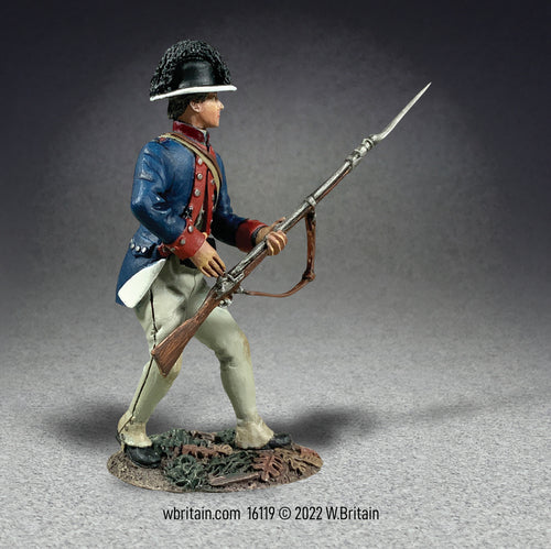 Collectible toy soldier miniature Legion of the United States dressed in blue jacket and white pants. Soldier is holding a musket and bayonet.