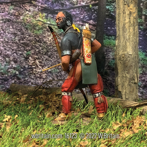 Collectible toy soldier army men Native Warrior with Bow and Arrow. In the forest.