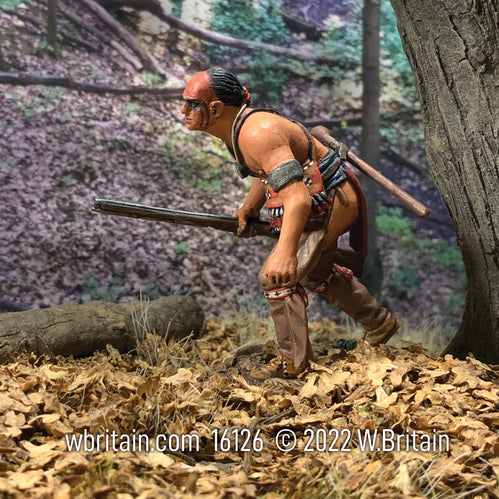 Collectible toy soldier miniature army men Native American Warrior Advancing Crouched Down. In the woods.