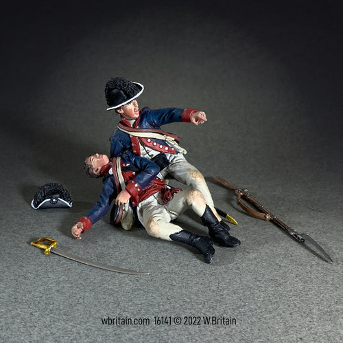 Collectible toy soldier miniature. Two soldiers on the ground with sword and musket laying nearby.