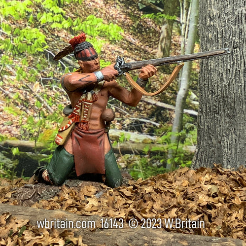 Collectible toy soldier army men Native American Warrior Kneeling Firing. He is near a tree.
