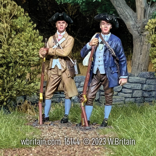 Collectible toy soldier miniatures. Two brothers in arms. Standing in colonial clothing while holding muskets outdoors.