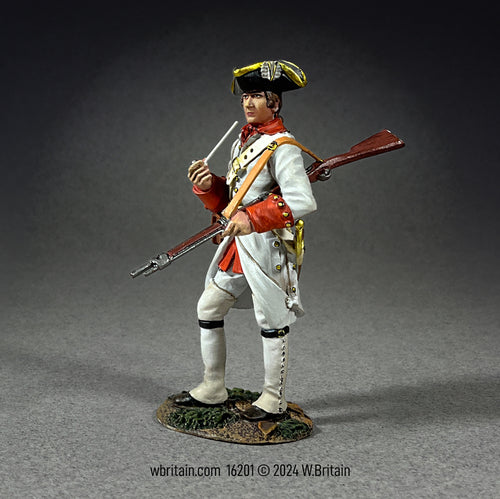 A highly detailed miniature figurine of a French Fusilier from the Regiment Berry, 1758. The soldier is dressed in a natural white wool coat, red vest, knee breeches, and high linen gaiters.