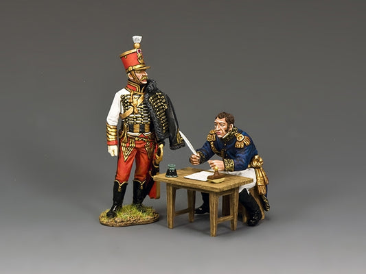 King & Country matte-painted metal two-figure set — a French staff colonel seated writing orders at a camp table, and a hussar aide-de-camp standing ready to deliver them.