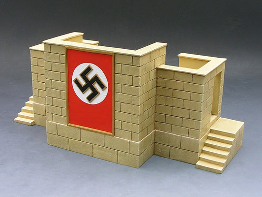 Model of a brick wall with a swastika flag on a gray background