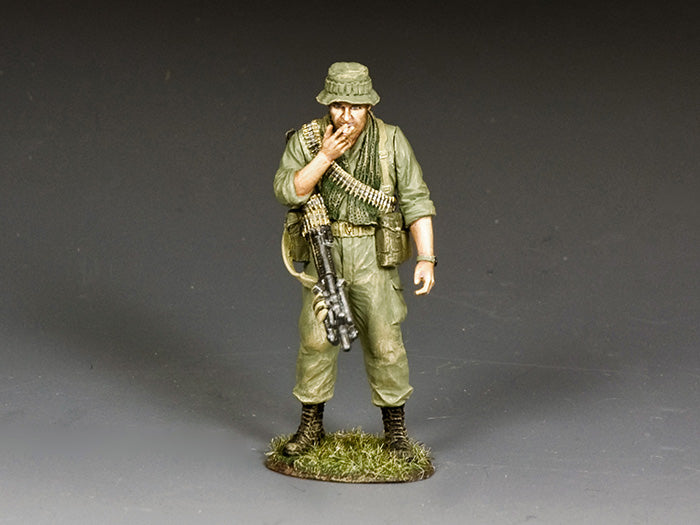Model of a soldier in military uniform with a rifle on a gray background