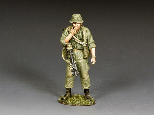 Model of a soldier in military uniform with a rifle on a gray background