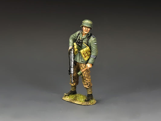 Model of a soldier in military uniform with a rifle on a gray background