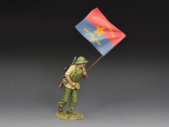 NVA Flagbearer. toy soldier figure of a soldier holding a flag against a gray background