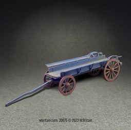 Miniature model of a historic ox-wagon, painted in shades of blue with contrasting red wheels. The wagon features a large, flat tray with high sides and a long tow bar, designed for being pulled by teams of oxen.