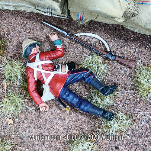 Collectible toy soldier miniature British 24th Foot Casualty No.2. Seen in a field.