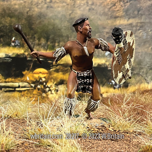 Toy soldier Zulu Warrior Attacking with Knobkerrie. On the battlefield.