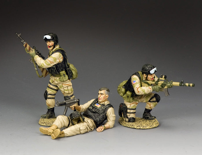 Three Delta Force figures from the Super Six Four rescue: one kneeling, one standing, and pilot Mike Durant seated with MP5K.