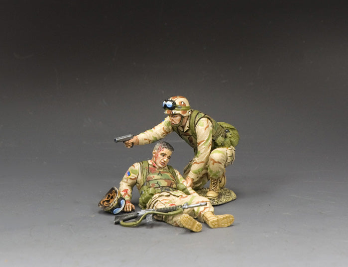 Stay Down. Two military figurines in a dynamic pose on a gray background