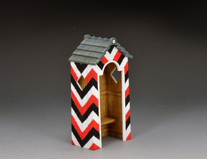 King & Country The German Guard Box, sentry hut with red, black, and white diagonal stripes in Wehrmacht-era colors, shingled grey roof, natural wood interior, 1/30 60mm matte diorama accessory, LAH269