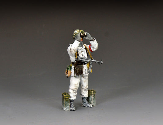 King & Country BBG139 figure of a German sergeant in a white snow suit raising binoculars to scan the sky, an MP40 slung across his chest and ammunition cans at his feet.