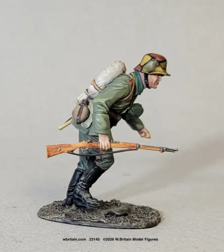 W Britain 23145 German Sturmtruppen Advancing No.2 1916-18 1/30 scale matte figure in camouflaged Stahlhelm and field grey, crouching forward with a Gewehr 98 held level in both hands, pack and blanket roll on his back, on an oval groundwork base.