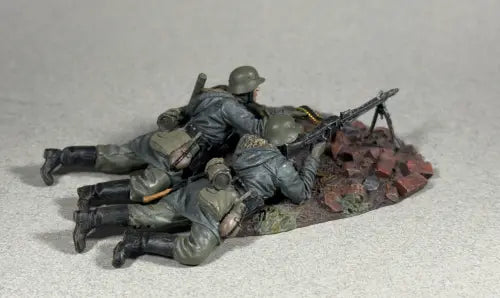 Model soldiers with weapons on a gray background
